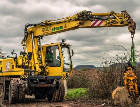 Excavator on land with potential restrictive covenants