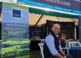 Oliver Lewis, white man sitting outsude the Hibberts Marquee at the Natwich Show