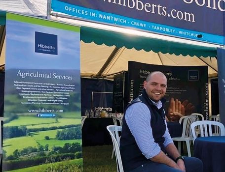 Oliver Lewis, white man sitting outsude the Hibberts Marquee at the Natwich Show